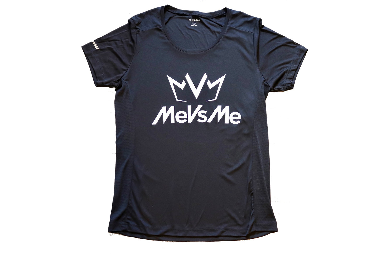 Frontside view of the black Women's MVM Performance Tee with MeVsMe logos.